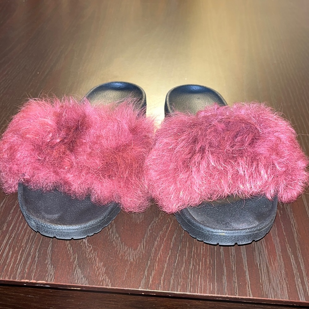 Slightly worn sandals with fur